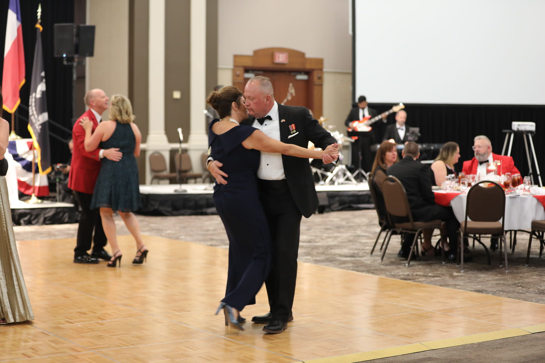 Wide view of the band on stage at a corporate gala